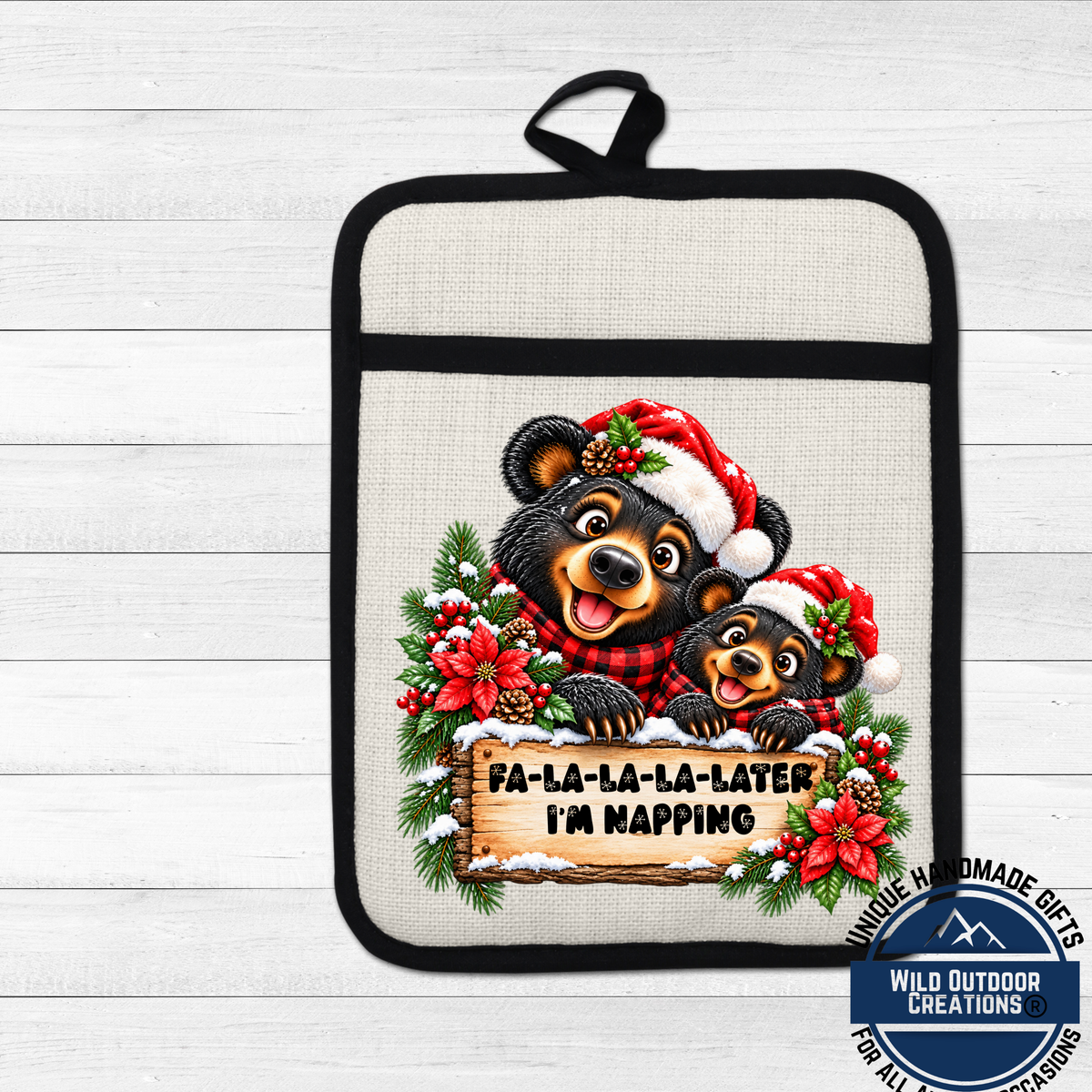 A pot holder with a cartoon image of two bears wearing Santa hats and holding a sign that says " Fa-la-la-la-later I'm napping".