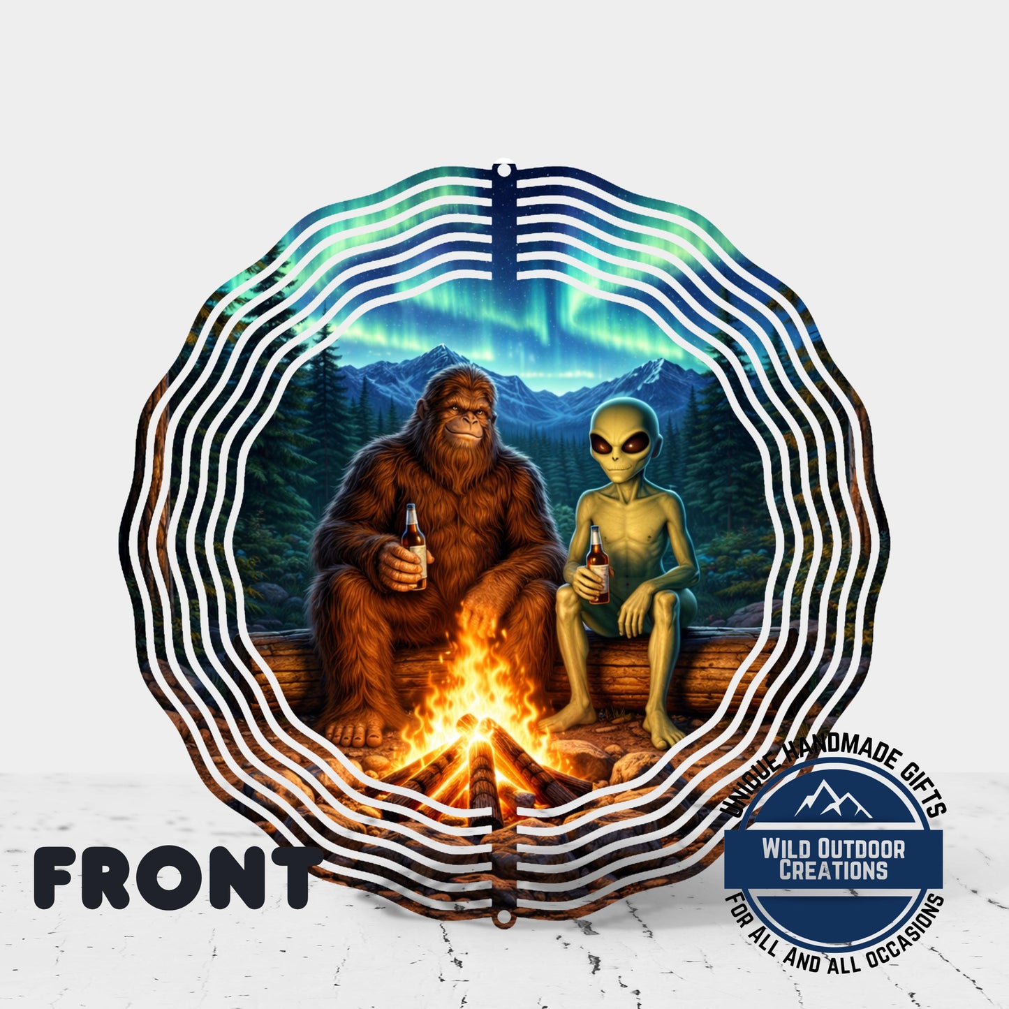 A large, brown-furred creature resembling a giant alligator or Sasquatch is sitting on a log by a campfire, with a smaller, green alien-like creature standing next to it. The background features a night sky with the northern lights and a forested landscape.