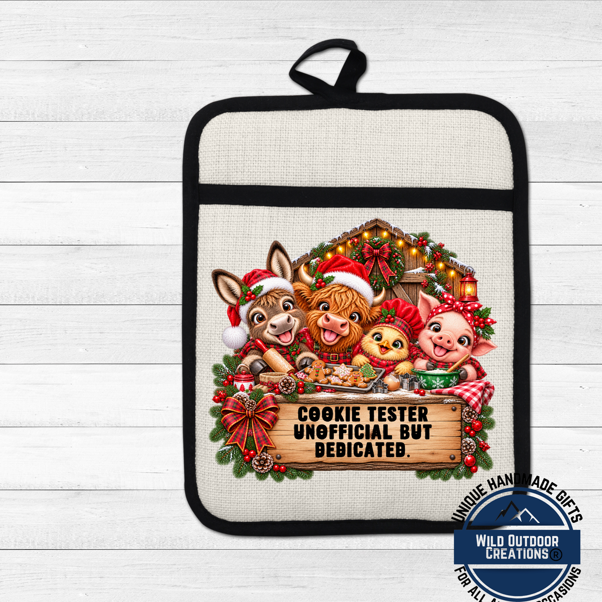 A hand-made pot holder featuring a cartoon image of a cow, pig, and chicken wearing Santa hats and holding a sign that says "Cookie Tester Unofficial But Dedicated".