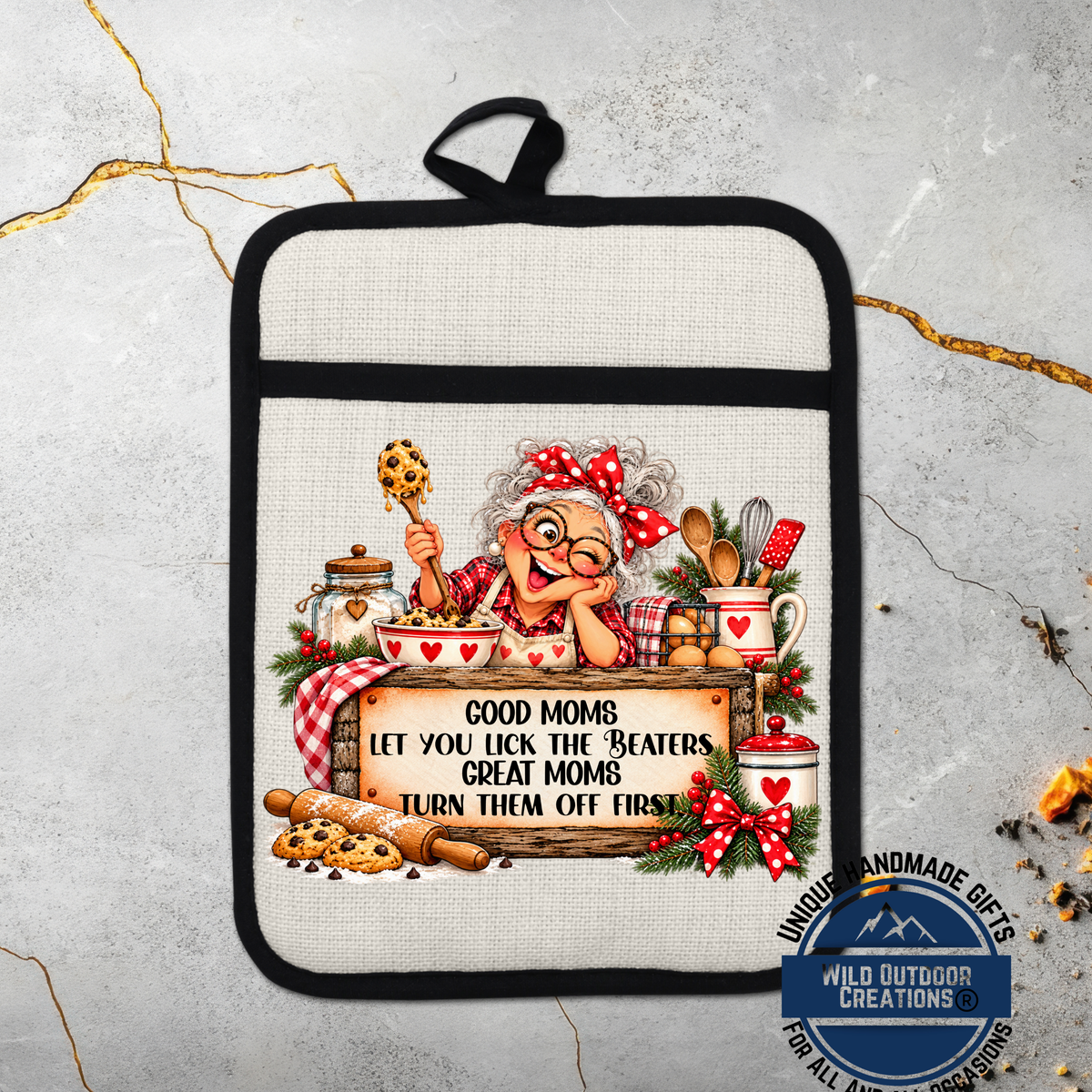 A hand-painted pot holder featuring an illustration of an elderly woman cooking, with a sign that says "Good Moms let you lick the beaters great Moms turn them off first".