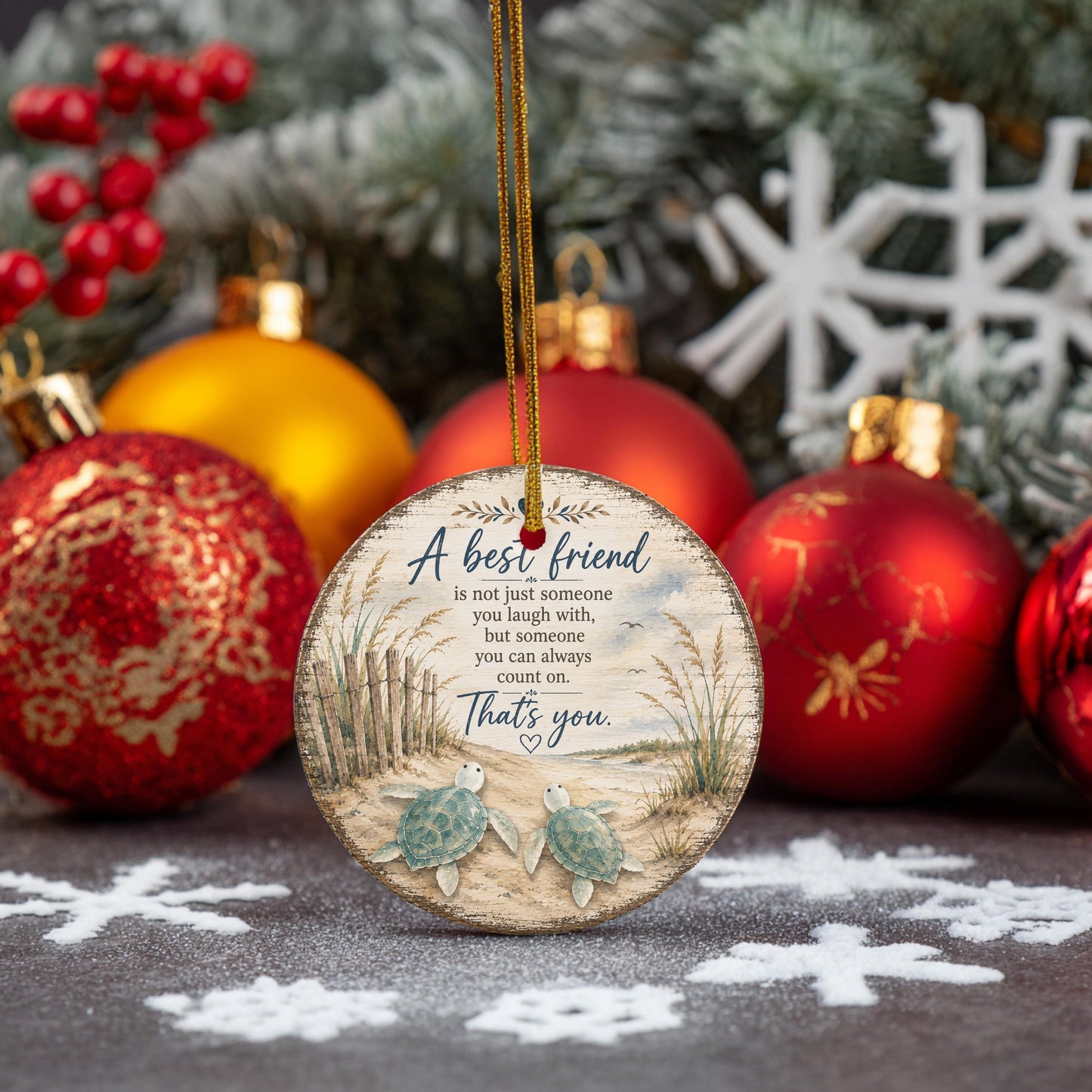 A wooden ornament with a message about a best friend, surrounded by Christmas ornaments and pine branches.