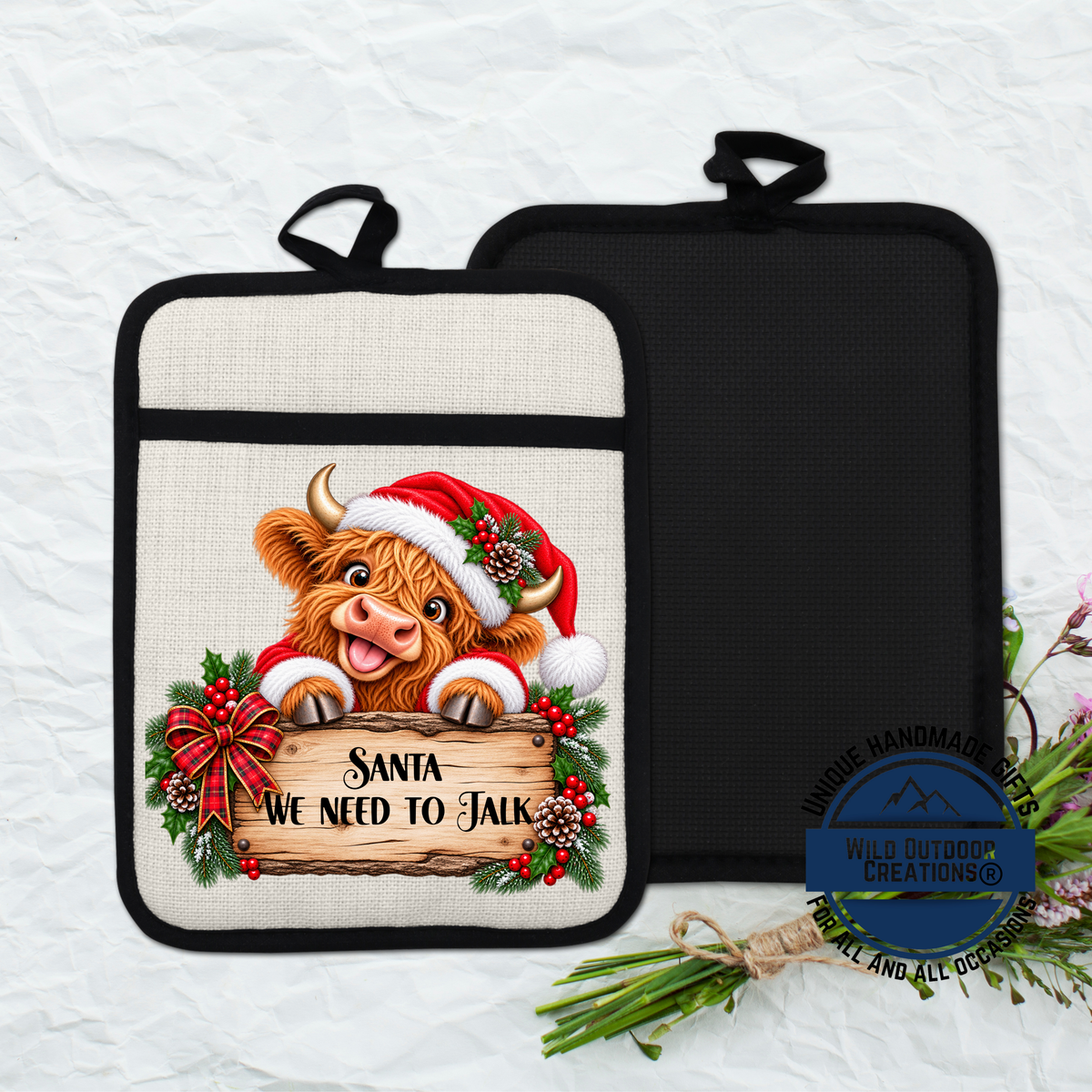 A kitchen pot with a Santa cow wearing a Santa hat and holding a sign that says "Santa we need to talk".