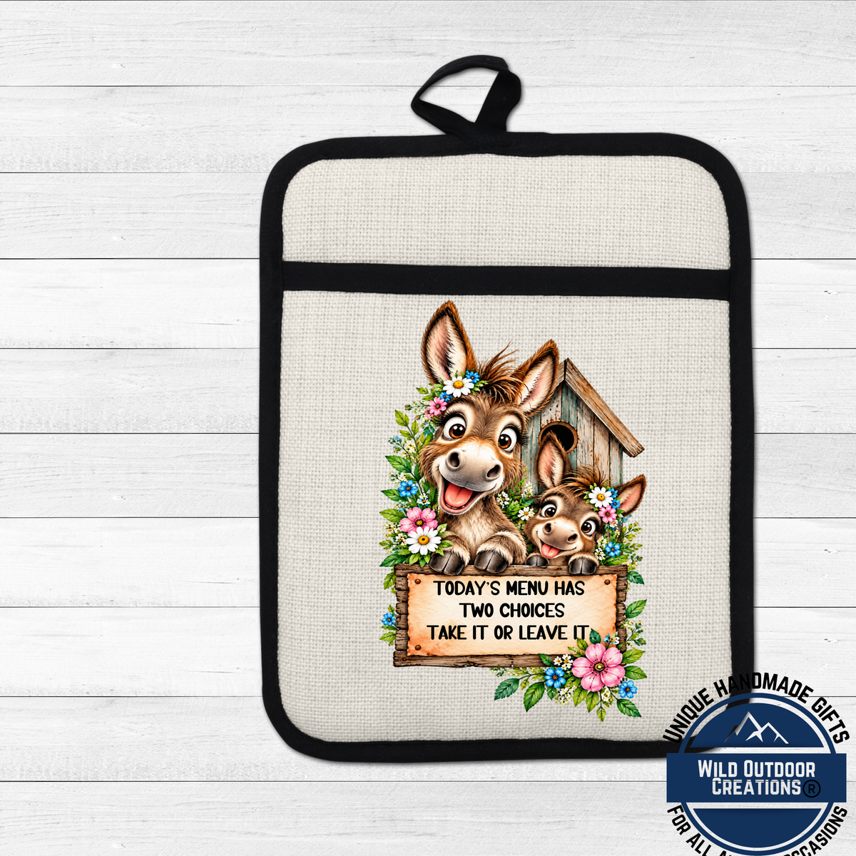 A kitchen pot holder with a cartoon donkey and a sign that says "Today's menu has two choices take it or leave it".
