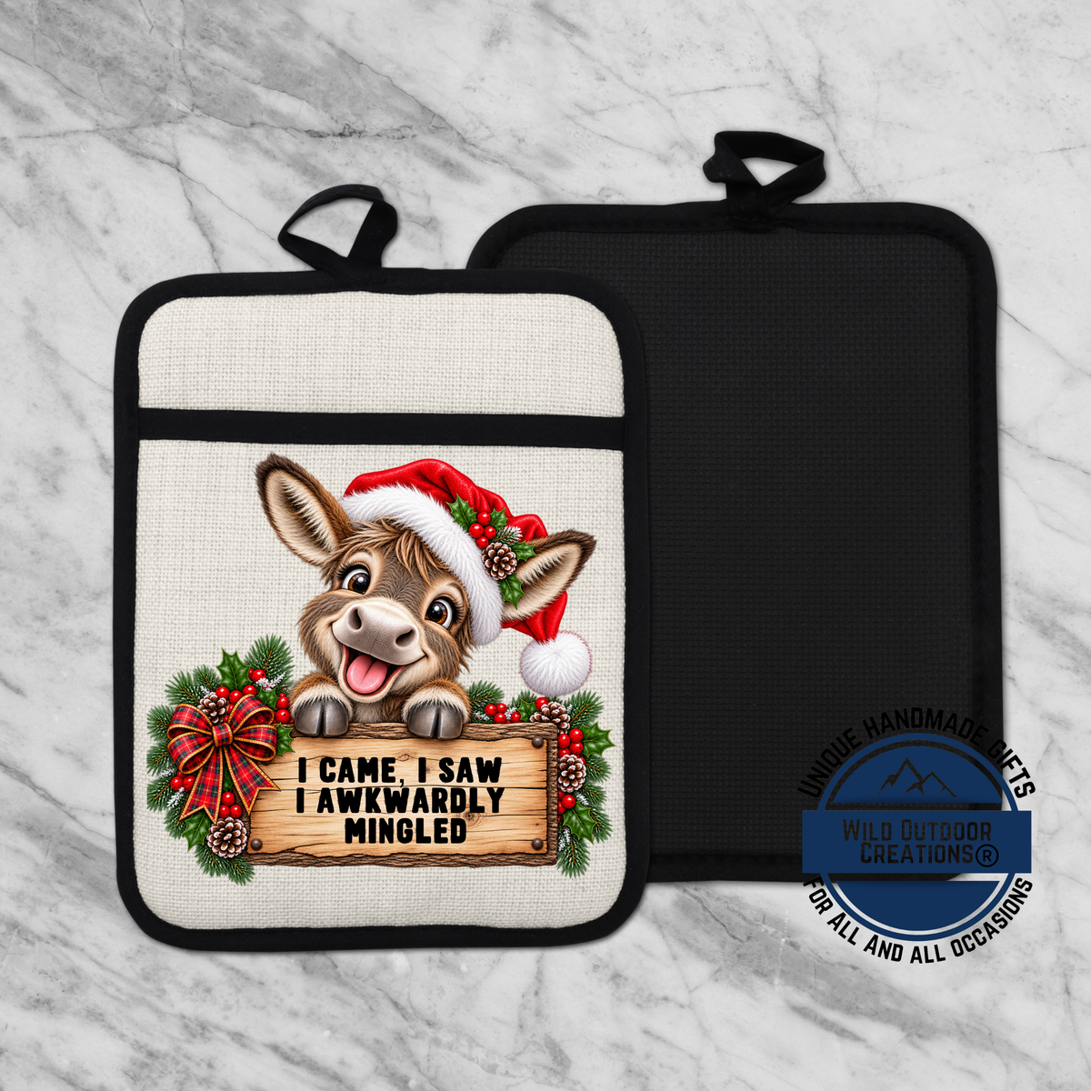 A kitchen pot holder with a cartoon donkey wearing a Santa hat and holding a sign that says "I came, I saw, I awkwardly mingled".