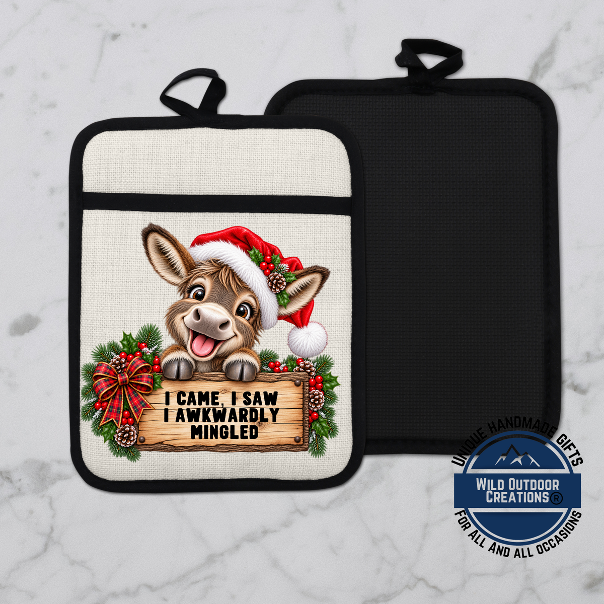 A pot holder with a cartoon donkey wearing a Santa hat and holding a sign that says "I came, I saw I awkwardly mingled".