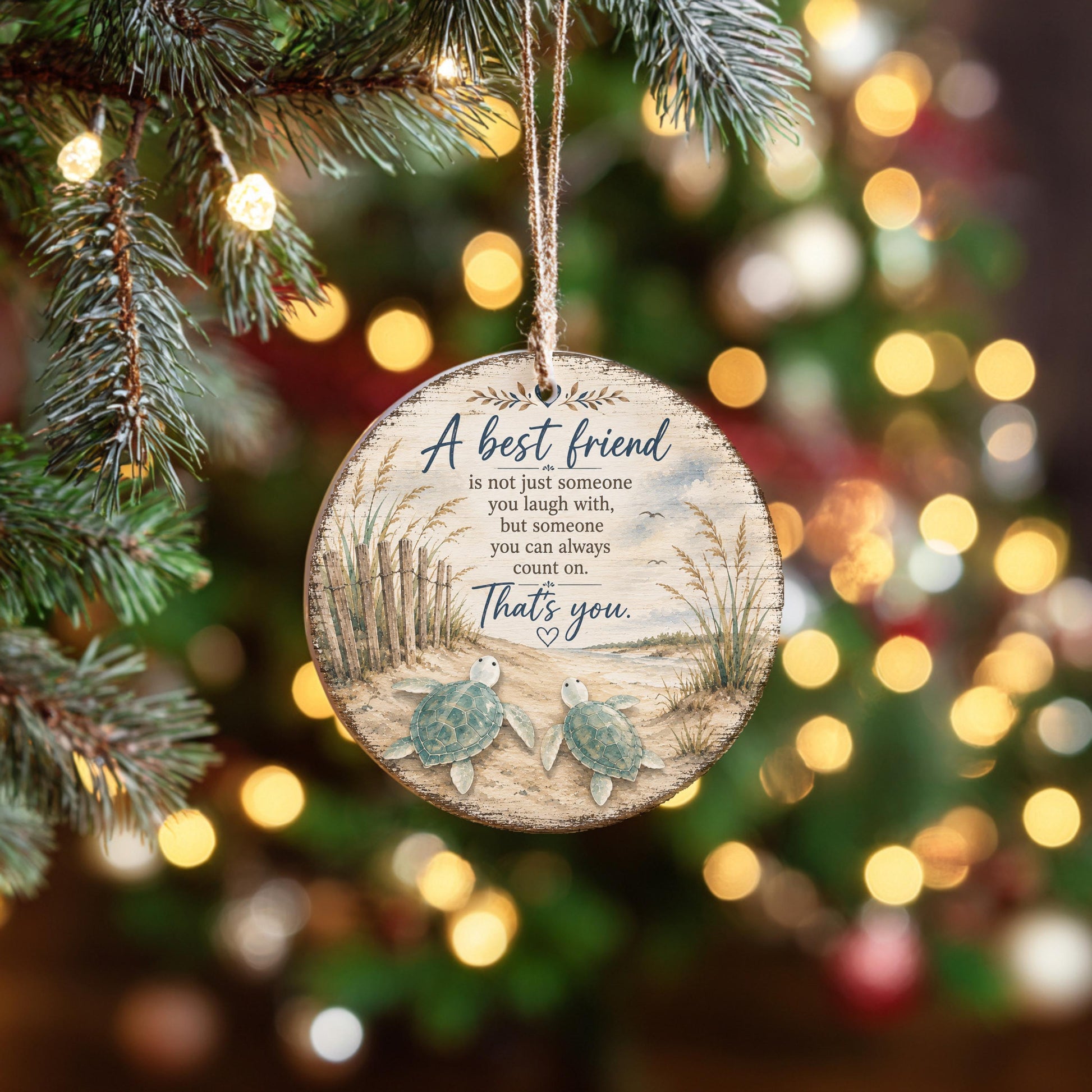 A round ornament hanging on a Christmas tree with a message about the importance of a best friend.