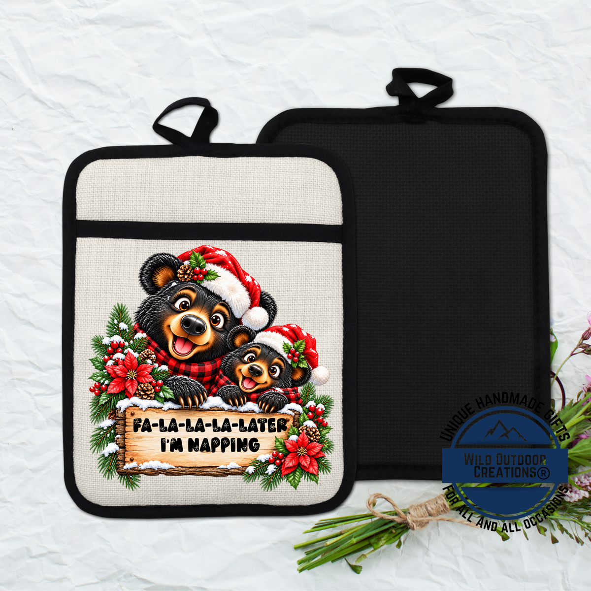 A beaver wearing a Santa hat and scarf is sitting on a sign that says " Fa-la-la-la-later I'm napping".