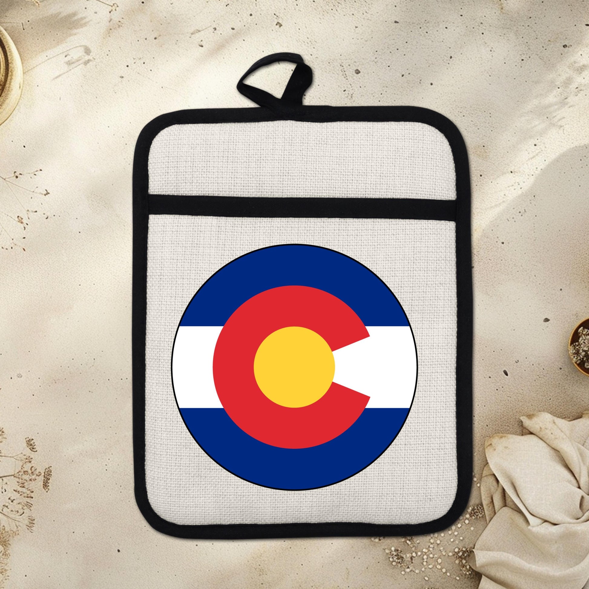 Colorado State Flag Pot Holder – Durable Linen & Silicone Kitchen Grip 9x7 Inches - displayed in garden