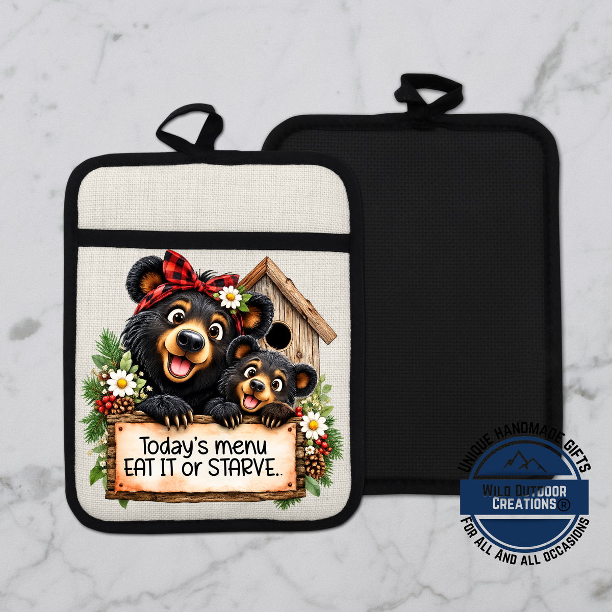 A kitchen pot holder with a cartoon image of two bears, one larger and one smaller, sitting in a birdhouse and holding a sign that says "Today's menu eat it or starve".