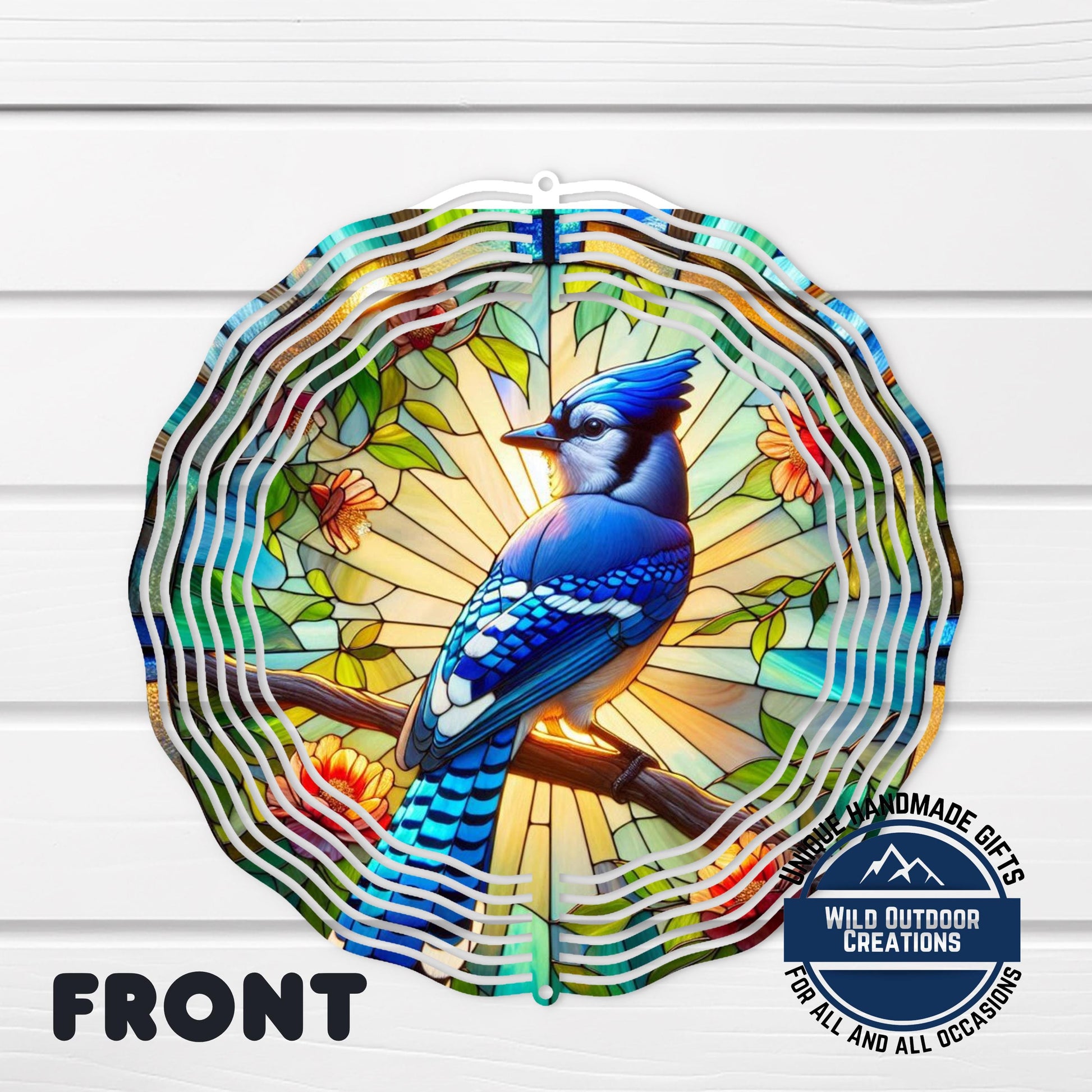 Blue Jay Wind Spinner – 10 Inch Aluminum Garden Spinner with Faux Stained Glass Decor - shown spinning in outdoor garden s...
